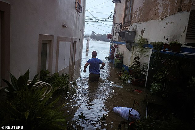 A deadly storm has sparked chaos in Spain and Portugal as ferocious winds and heavy flooding submerged towns (Pictured: Alcacer do Sal in Portugal)
