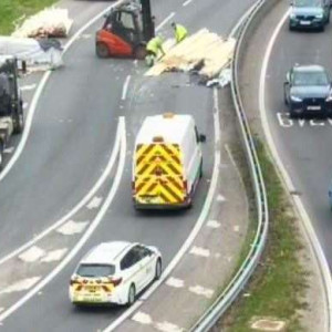 The recovery of the lorry's load on the M2 London-bound entry slip road at the Stockbury roundabout, Sittingbourne, is underway. Picture: National Highways