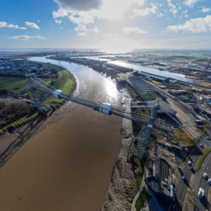 The Newport transporter bridge which spans the River Usk symbolising the city's industrial heritage when huge quantities of Welsh coal and steel were loaded on to ships at its docks.