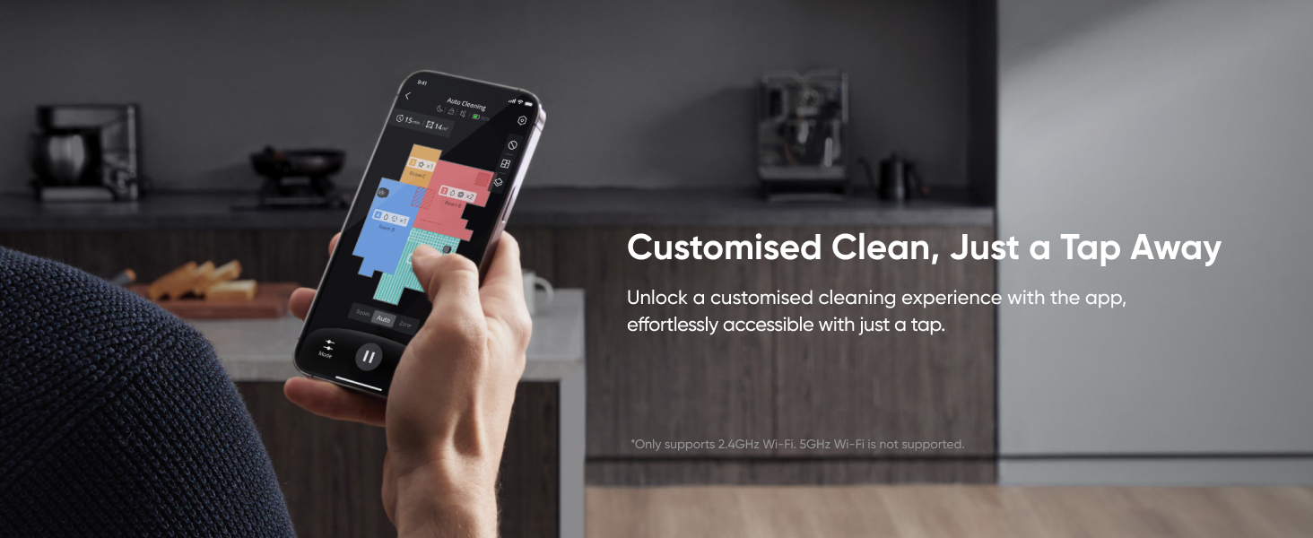 Smartphone displaying a cleaning app interface with colored tiles, shown against a dark room background with 'Customised Clean' text overlay.