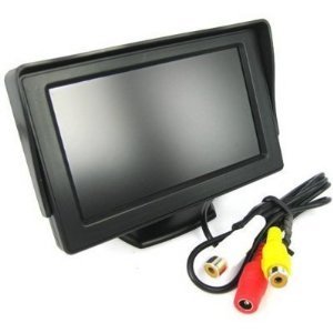 Red brake light camera for vehicle rear. Image shows installation in cargo area of a delivery van with open doors.