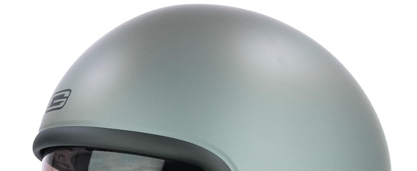 Pale green open-face motorcycle helmet with black interior padding, tinted visor, and red chin strap. Compact scooter-style helmet with ventilation holes.
