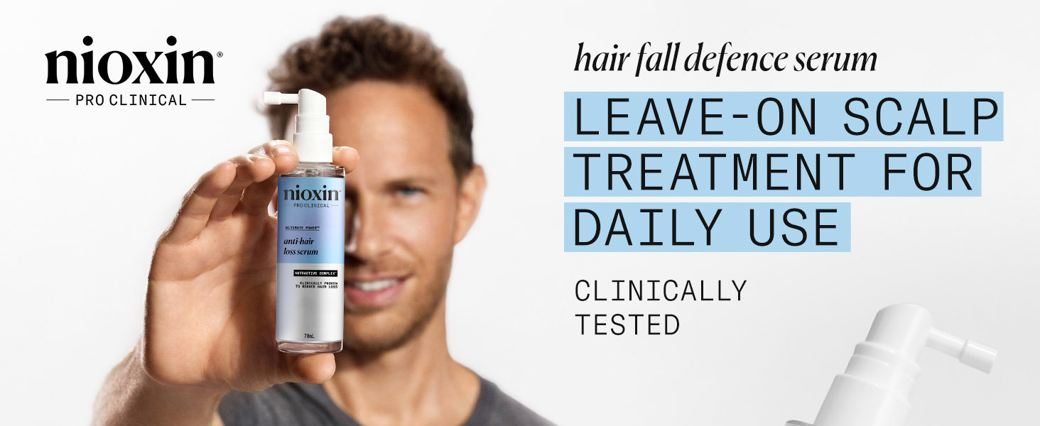 Text reads 'LEAVE-ON SCALP TREATMENT FOR DAILY USE' 'hair fall defence serum' 'CLINICALLY TESTED'. Blue product bottle shown with advertising elements.