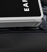 Close-up product shots showing black electronic device with LED display against dark background.