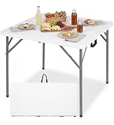 Foldable rectangular white table with metal legs, shown set up with place settings and fruit. Bottom panels display folded configuration and carrying handle for portability.
