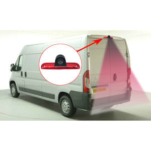 White delivery van with rear-view camera highlighted by red circle and arrow. Inset image shows camera view of area behind vehicle.