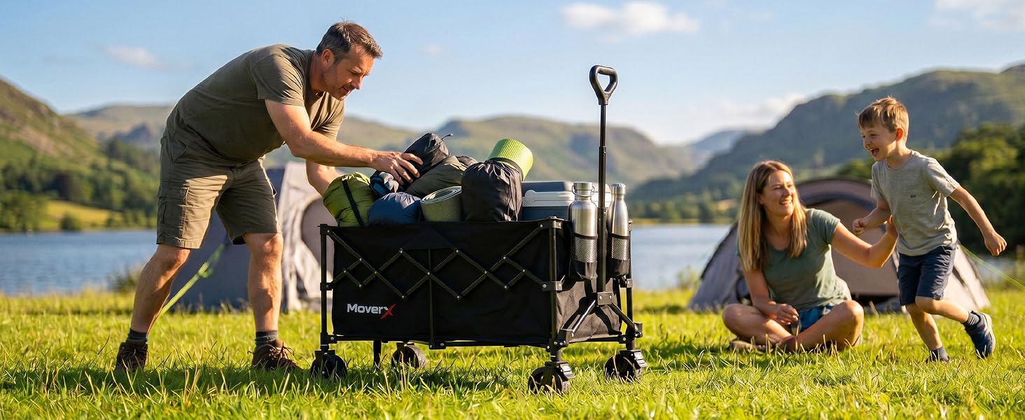 Outdoor scene with two people in casual clothing standing near barbecue grill in mountainous grassland landscape during daytime.
