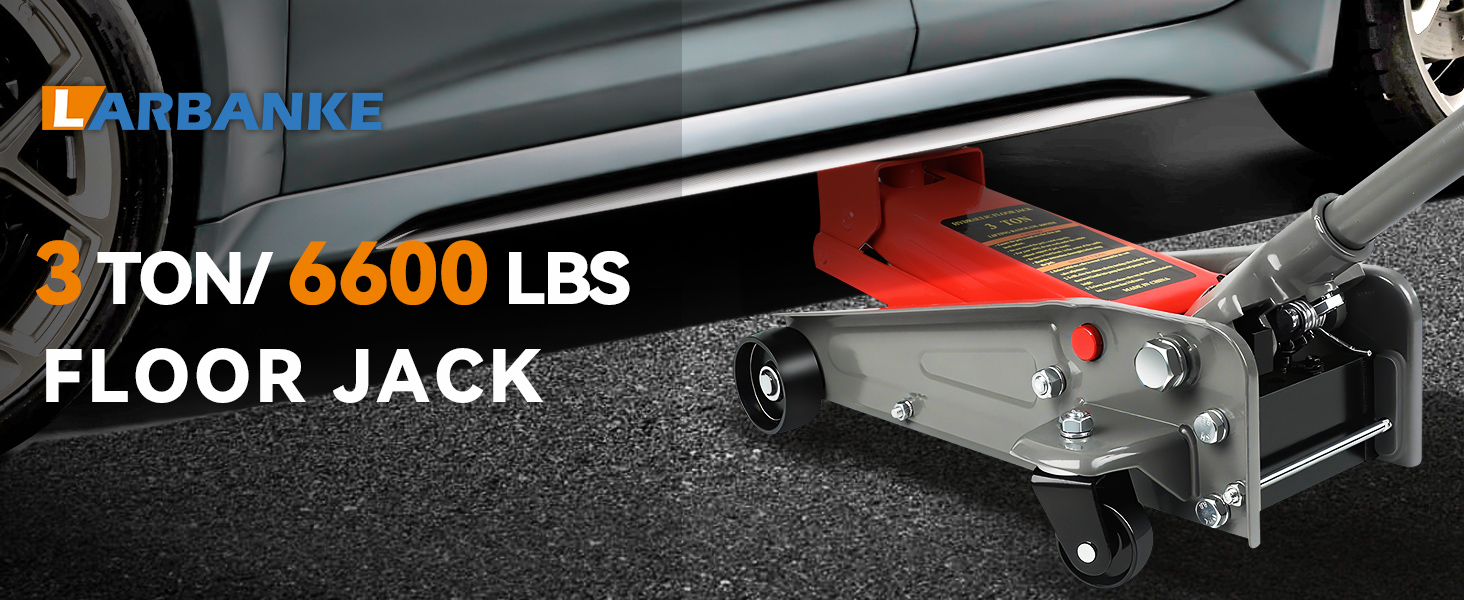 Text reads 'FLOOR JACK' on automotive equipment. Heavy-duty metal floor jack shown in workshop or garage setting.