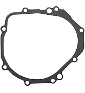Additional set of engine gaskets with complex curved shapes and mounting points, displayed in dark grey color from different angles.