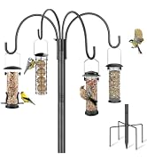 Ornate black metal bird feeding station stand with multiple hanging feeders: cylindrical cage feeders, dome feeders, and seed holders. Various feeders in different colors (green, brown, copper) suspended from decorative scrollwork frame with metal rake tool.