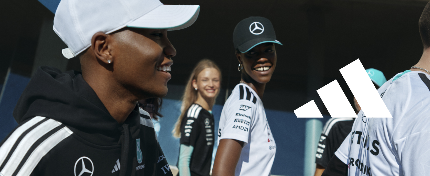 Group sporting event scene showing supporters in white and black athletic wear with Mercedes-Benz branding.