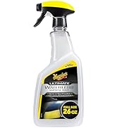 Collection of Meguiar's car care products including spray bottles, liquid containers, and cleaning solutions in a promotional group display.