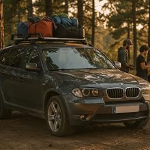 Multiple photos showing black luxury vehicles in snowy winter conditions. People in colorful winter gear gather around cars with roof-mounted cargo carriers against pine forest backdrop.