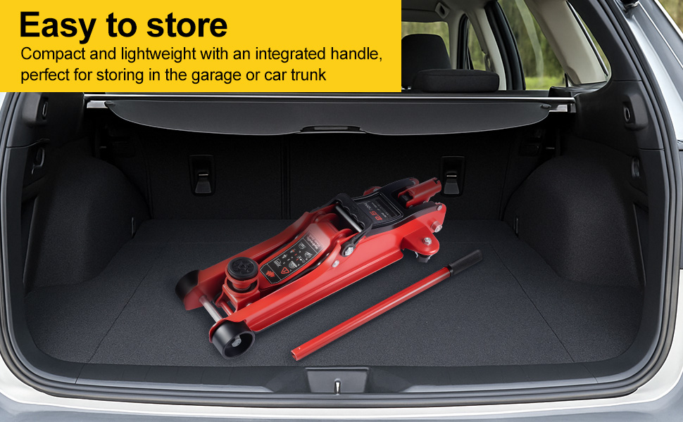 Red hydraulic floor jack in car trunk. Compact design with integrated handle for easy storage. Text highlights storage convenience in garage or car trunk.