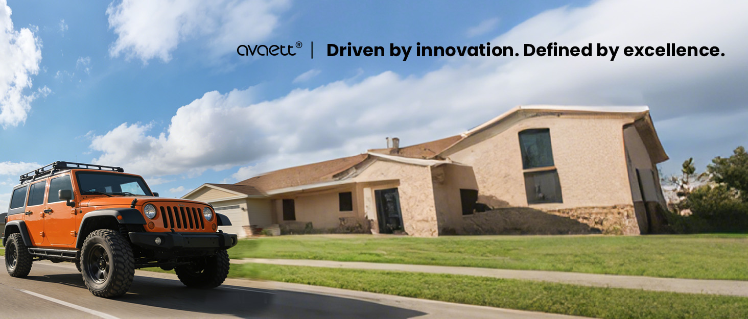 Text reads 'DOOSAN | Driven by Innovation. Defined by excellence.' Panoramic image showing industrial or commercial buildings with orange vehicle visible and blue sky background.