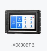 Text reads "AD Pro". Blue rectangular device with screen display and carrying handle shown against white background.