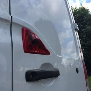 the rear door of a white van
