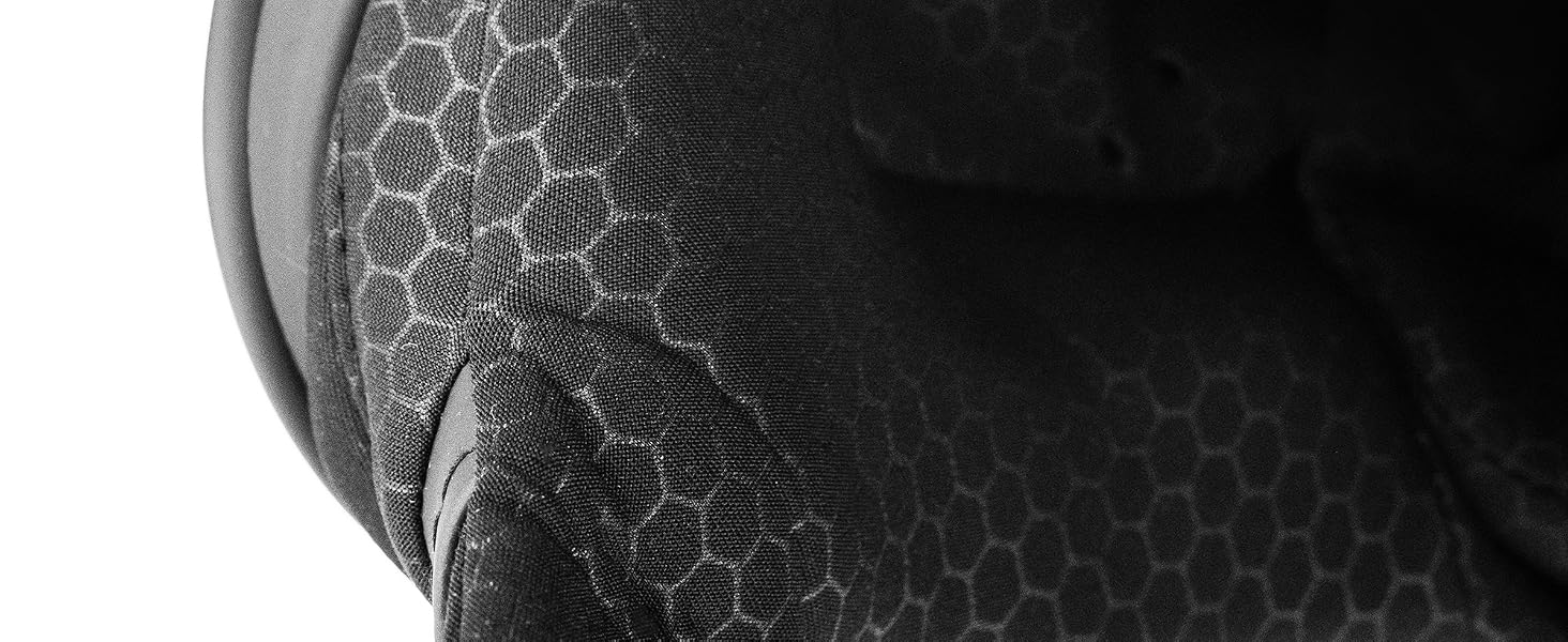 Close-up detail of black textured material with hexagonal honeycomb pattern visible on curved surface, appears to be protective gear or equipment component.