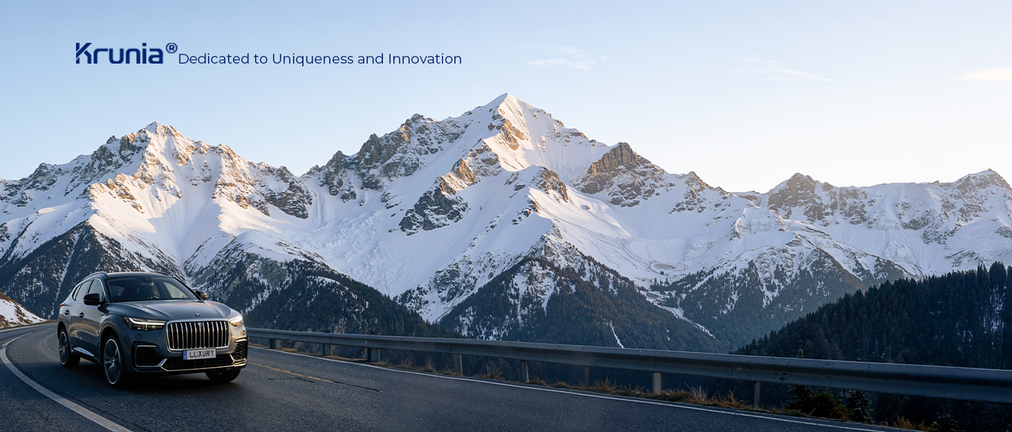 Scenic winter mountain landscape with snow-capped peaks against blue sky. Text visible reads 'Krudo'.