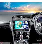 In-dash car entertainment system installed in vehicle, showing navigation interface with app icons against blue sky background through windshield.