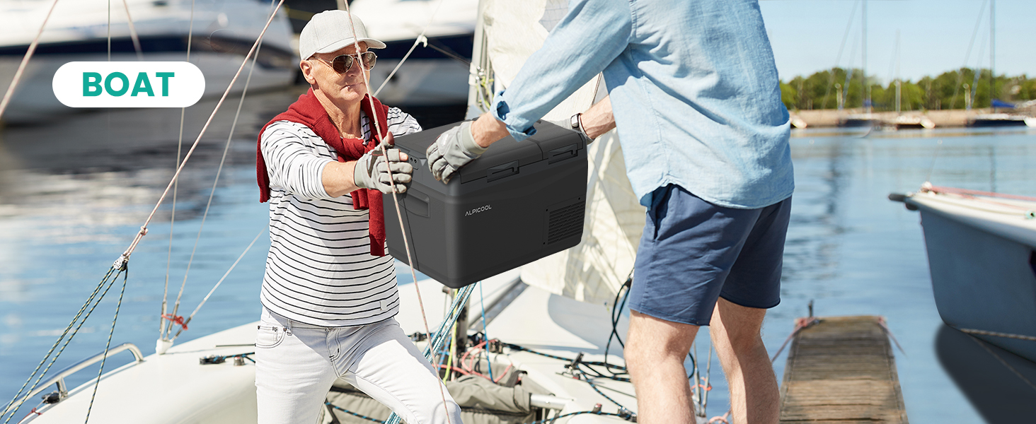 Text reads: 'BOAT'. Two people on a boat deck near water, one wearing red and white striped shirt, one in blue shorts, near boat rigging and equipment.