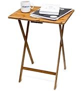 Decorative plant stand with wooden top and metal base. Rectangular table features black legs with heart-shaped designs. Six potted plants displayed on patterned surface.