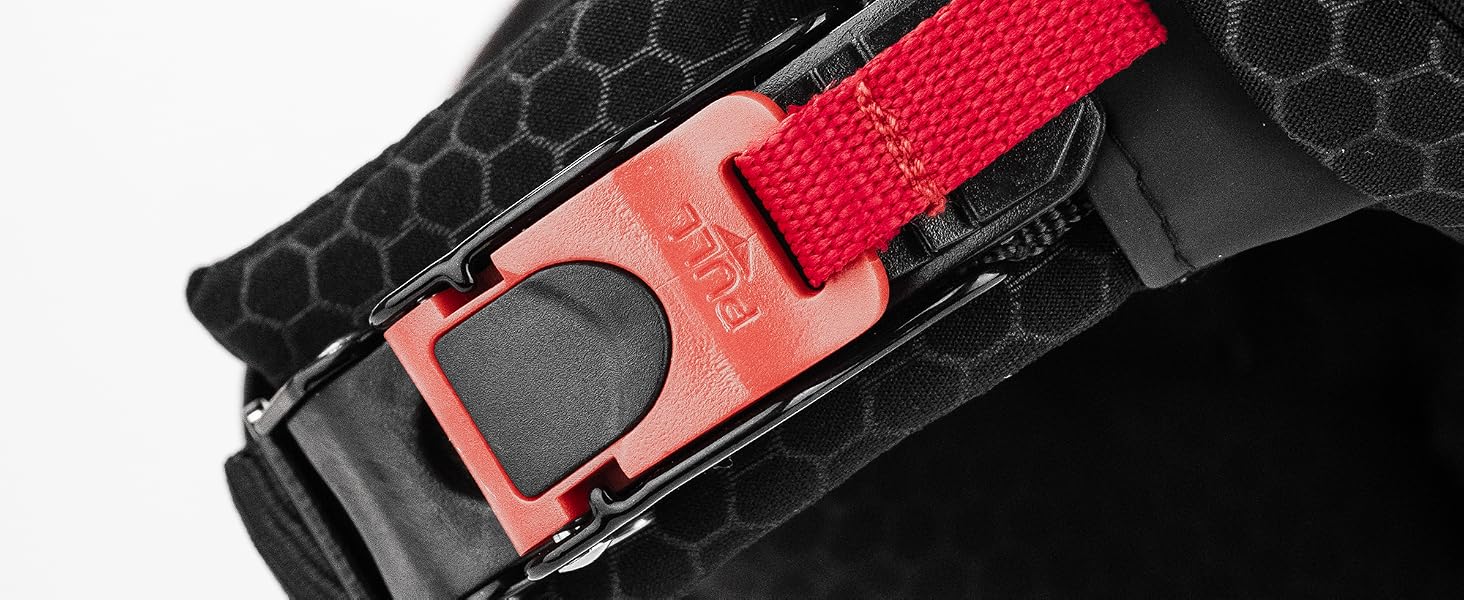 Red and black nylon belt with metal buckle clasp, displayed across textured dark fabric background.
