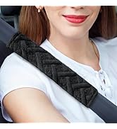 Black tactical or gear holster with multiple attachment points and buckle closures, shown from two angles displaying front and side views.