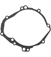 Collection of engine gaskets and seals in dark grey color, showing various curved shapes and mounting holes for engine assembly.