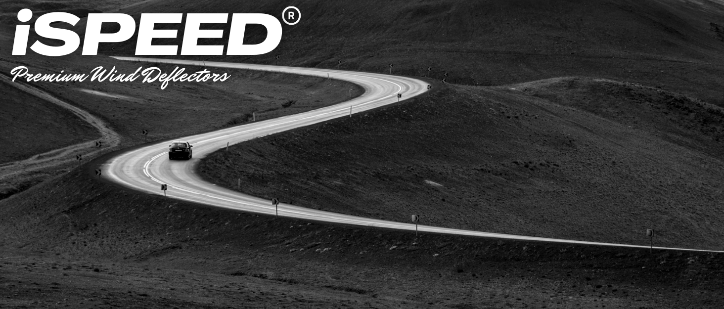 Black and white aerial photograph of a winding mountain road with iSPEED Premium Road Protection text overlay.