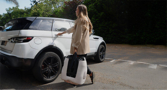 Multiple views of a white SUV or crossover vehicle with person near the trunk area in outdoor parking settings.