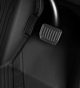 Multiple views of a black rectangular speaker or audio device with sharp angular design, showing different angles and perspectives against dark and illuminated backgrounds.
