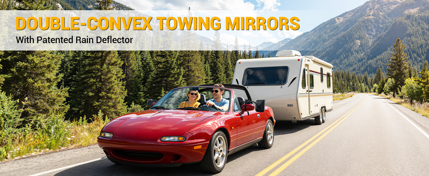 Text reads 'DOUBLE CONVEX TOWING MIRRORS With Patented Rain Reflector'. Red convertible car towing a travel trailer on a mountain road with forests and peaks in background.