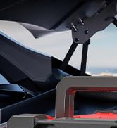 Close-up sequence showing the installation or setup of a dark-colored device on what appears to be a textured surface.
