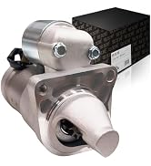 Car starter motor assembly with cylindrical gray metal body, mounting brackets, internal components visible, displayed with black branded packaging box.