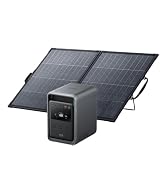 Portable solar panel array with two foldable black panels connected to compact black power station unit with display screen and handles.