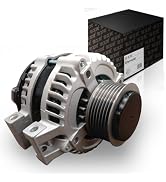 Automotive alternator component with metallic finish, ribbed cooling fins, threaded bolt holes, pulley wheel, and associated black electronic module displayed against white background.